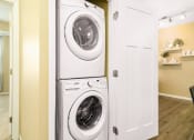 Thumbnail 15 of 49 - a washer and dryer in a laundry room at Skye at Arbor Lakes, Minnesota, 55369