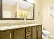 Thumbnail 14 of 49 - a bathroom with two sinks and a toilet at Skye at Arbor Lakes, Maple Grove, Minnesota
