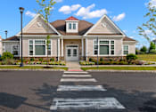 Thumbnail 31 of 33 - a house with a cross walk in front of it at The Landing Apartment , Hazlet, NJ
