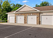 Thumbnail 27 of 33 - the front of a brick building with three garage doors at The Landing Apartment , Hazlet, 07730