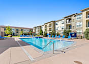 Thumbnail 33 of 48 - our apartments offer a swimming pool with an apartment building in the background