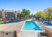 Thumbnail 27 of 40 - our apartments have a resort style pool with lounge chairs at Silver Reef Apartments, Lakewood, Colorado