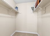 Thumbnail 13 of 40 - a spacious closet in a bedroom with white walls and shelves at Silver Reef Apartments, Lakewood, CO, 80228