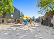 Thumbnail 33 of 40 - our yard is big and has a table and chairs with an umbrella at Silver Reef Apartments, Lakewood, CO, 80228