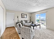 Thumbnail 9 of 35 - a living room with a couch and two chairs at Park 88 Apartments, Colorado, 80229