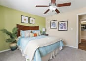 Thumbnail 15 of 38 - a bedroom with a bed and a ceiling fan at 150 Summit, Birmingham