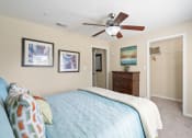 Thumbnail 16 of 38 - a bedroom with a bed and a ceiling fan at 150 Summit, Birmingham, AL, 35243