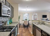 Thumbnail 3 of 38 - the preserve at ballantyne commons apartments kitchen and dining area at 150 Summit, Birmingham, 35243
