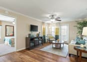Thumbnail 10 of 38 - a living room with a ceiling fan and a couch at 150 Summit, Alabama, 35243