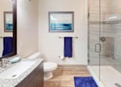 Thumbnail 22 of 65 - A bathroom with a toilet, sink, and shower. at Centre Pointe Apartments, Melbourne, Florida