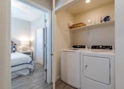 Thumbnail 8 of 15 - A small laundry room with a washer and dryer. at Vistoria At Marley Park Apartments, Surprise