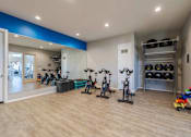 Thumbnail 12 of 15 - A room with exercise equipment and storage at Vistoria At Marley Park Apartments, Surprise