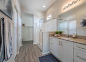 Thumbnail 5 of 15 - A bathroom with a striped towel hanging on the door. at Vistoria At Stadium Apartments, Arizona