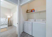 Thumbnail 5 of 15 - A small laundry room with a washer and dryer. at Vistoria At Country Place Apartments, Arizona