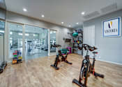 Thumbnail 13 of 15 - A gym with exercise equipment and a sign that says "Victoria".