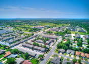 Thumbnail 28 of 29 - an aerial view of a suburban neighborhood with houses and trees