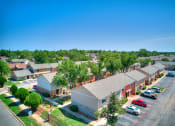 Thumbnail 26 of 29 - an aerial view of a neighborhood of houses with cars parked