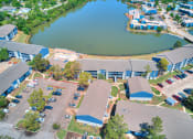 Thumbnail 22 of 24 - an aerial view of a group of buildings and a lake