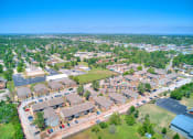 Thumbnail 28 of 29 - an aerial view of a neighborhood with houses and cars on the street at Diamond  Trail Apartments, Oklahoma City, OK
