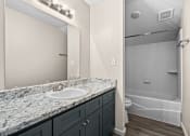 Thumbnail 7 of 40 - a bathroom with a sink and a shower and a mirror at Diamond Ridge Townhomes, Oklahoma City Oklahoma   