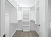 Thumbnail 25 of 40 - a walk in closet with white shelves and a spiral staircase at Diamond Ridge Townhomes, Oklahoma City, 73114  