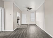 Thumbnail 15 of 40 - an empty room with white walls and a ceiling fan at Diamond Ridge Townhomes, Oklahoma City, 73114  