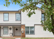 Thumbnail 38 of 40 - a white house with a tree in front of it at Diamond Ridge Townhomes, Oklahoma City, OK  