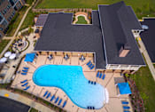 Thumbnail 29 of 37 - an aerial view of a swimming pool in front of a house at Annandale Apartment Homes, Tennessee