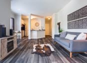 Thumbnail 1 of 35 - Large living room off of a kitchen with wood style flooring