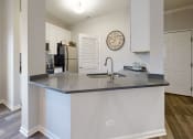 Thumbnail 3 of 35 - a kitchen with a large counter top and a sink