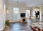 Thumbnail 8 of 35 - a living room with a tv and a dining room