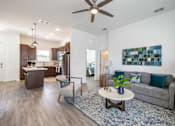 Thumbnail 4 of 46 - a living room with a couch and a coffee table at Artesia at Lakewood Ranch Apartments, Florida 34211