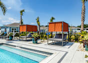 Thumbnail 24 of 36 - Sun deck next to a resort style swimming pool at Estia at Lakewood Ranch, Bradenton, FL, 34211