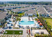 Thumbnail 17 of 36 - Aerial view of the swimming pool and sun deck at Estia at Lakewood Ranch, Bradenton, FL