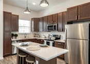 Thumbnail 1 of 36 - Gourmet kitchen with an island at Estia at Lakewood Ranch, Bradenton, 34211
