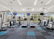 Thumbnail 28 of 40 - a large fitness room with treadmills and other exercise equipment