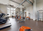Thumbnail 24 of 34 - Gym equipment at The Millennium Towne Center Apartments, Baton Rouge, LA, 70806