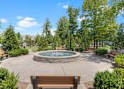Thumbnail 37 of 40 - a park with a fountain and benches