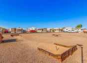 Thumbnail 19 of 26 - an rv park with a dirt field in front of it