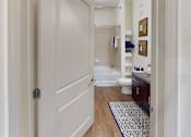 Thumbnail 7 of 24 - a bathroom with a white toilet next to a bathtub at Integra 360 Apartments, Florida