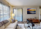 Thumbnail 4 of 27 - a living room filled with furniture and a large window