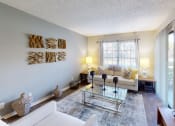 Thumbnail 3 of 27 - a living room with white couches and a glass coffee table