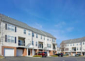 Thumbnail 15 of 20 - Building exterior with garages