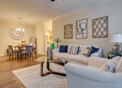 Thumbnail 4 of 26 - a living room with two couches and a coffee table at Magnolia Village Apartments, Jacksonville, Florida