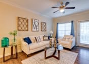 Thumbnail 6 of 26 - a living room with two couches and a coffee table at Magnolia Village Apartments, Jacksonville, FL, 32207