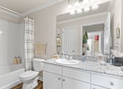 Thumbnail 16 of 40 - a bathroom with a sink toilet and bathtub