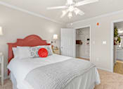 Thumbnail 13 of 40 - a bedroom with a bed and a ceiling fan