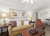 Thumbnail 10 of 40 - a living room filled with furniture and a ceiling fan