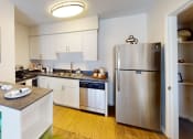 Thumbnail 1 of 19 - a kitchen with stainless steel appliances and white cabinets  at Somerset Apartments, Largo, FL, 33774