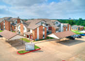 Thumbnail 9 of 14 - an aerial view of a row of houses in a parking lot